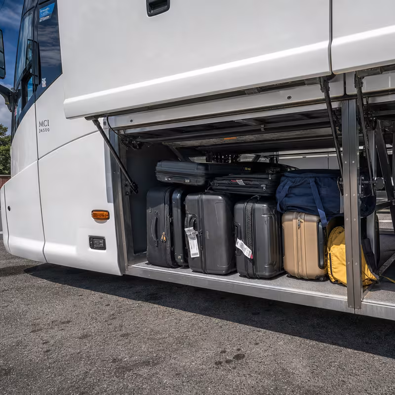 Party bus interior with wraparound leather seating and LED lighting in Kansas City