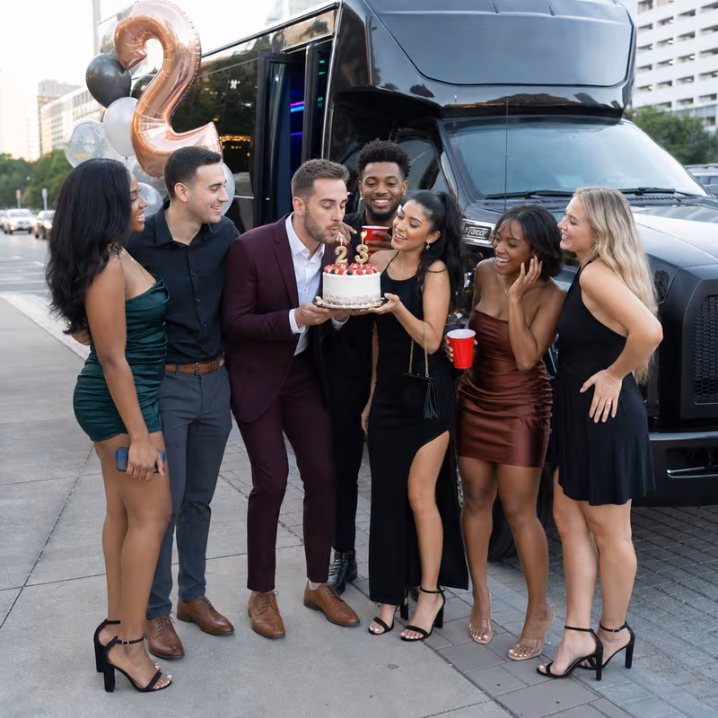 Party bus interior with wraparound leather seating and LED lighting in Kansas City