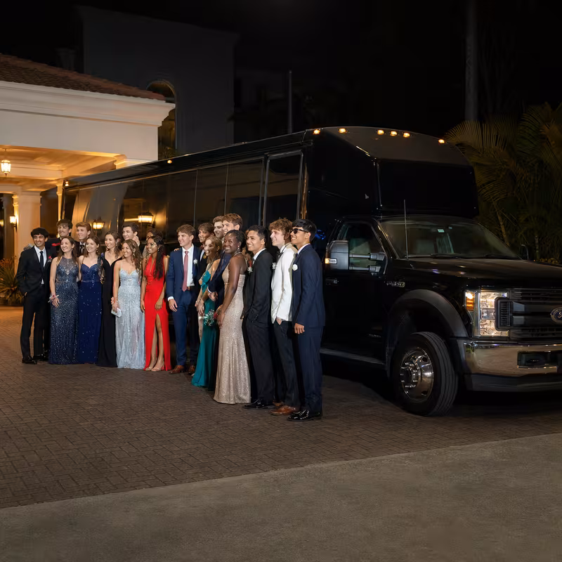 Party bus interior with wraparound leather seating and LED lighting in Kansas City