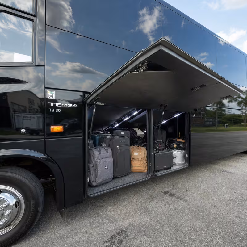 Party bus interior with wraparound leather seating and LED lighting in Kansas City