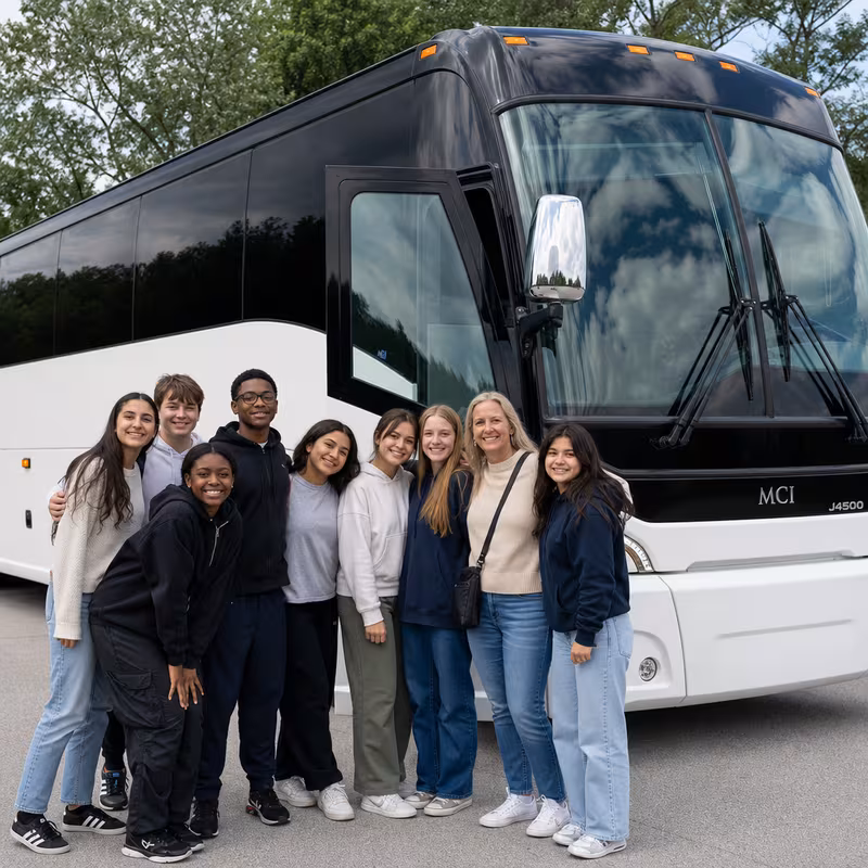 Passengers loading luggage while boarding an Kansas City group shuttle