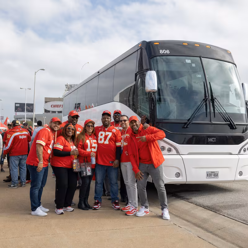 Passengers loading luggage while boarding an Kansas City group shuttle