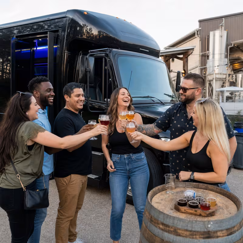 Passengers loading luggage while boarding an Kansas City group shuttle